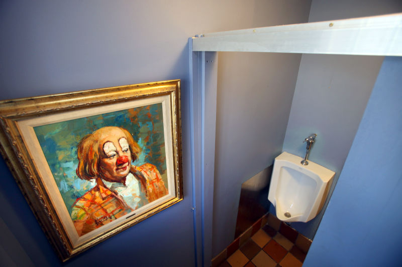 Tip Top Tavern bathroom with clown painting